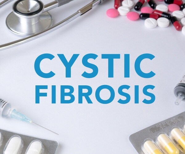 Cystic Fibrosis surrounded by pills, syringe, stethoscope