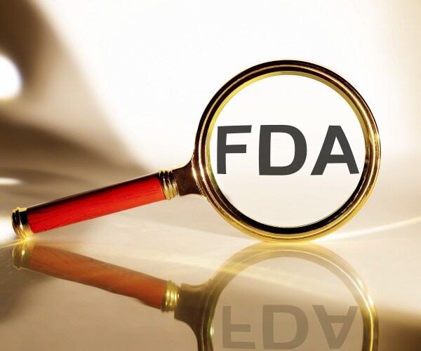 magnifying glass magnifying "FDA"