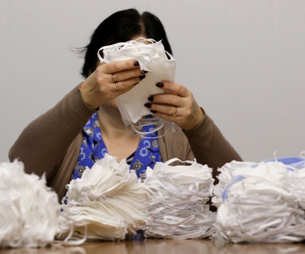 a woman is shown sorting facial masks 