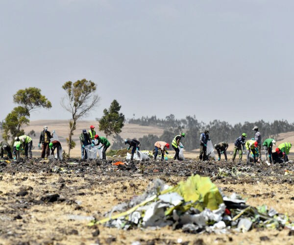people clean up the crash scene