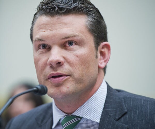  Fox News' Pete Hegseth is shown in grey pinstrip suit, dress shirt and tie