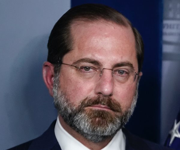 alex azar prepares to speak at a news conference