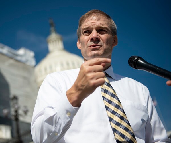 jim fordan stands in front of the capitol dome and speaks to press