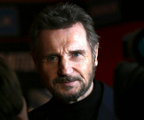 actor liam neeson looks on stately