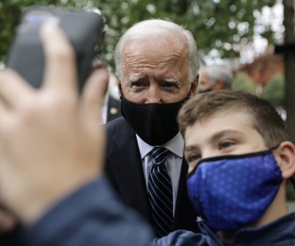 joe biden take selfie with young man
