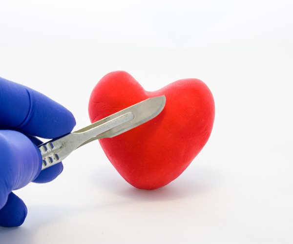 small knife on stuffed heart to denote heart surgery