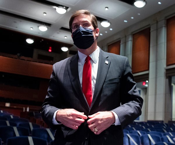 Mark Esper walking through the capitol