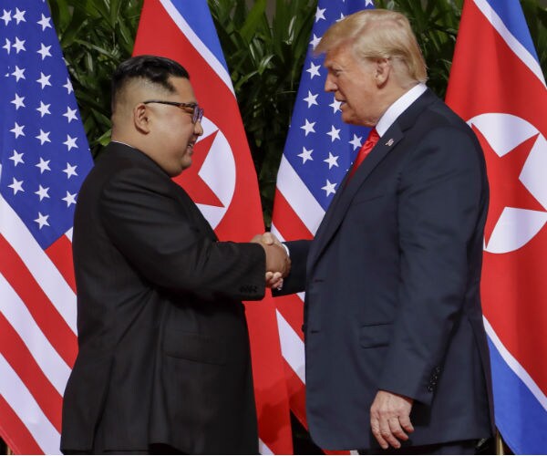 Trump, Kim Shake Hands to Begin Historic Summit