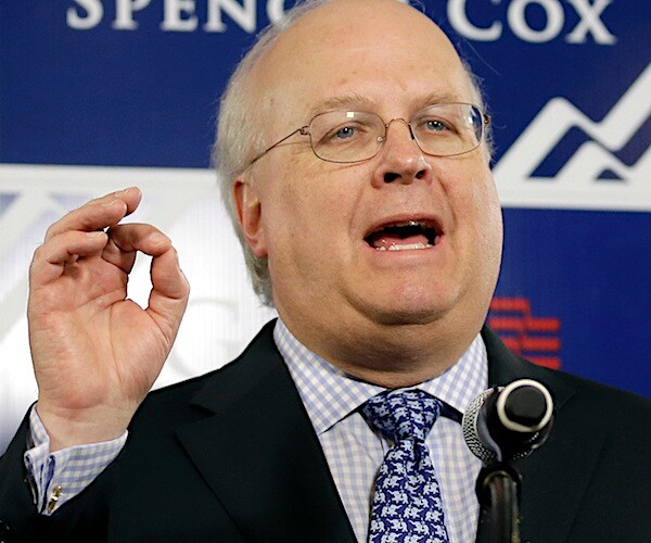 karl rove gestures with his right hand during a campaign speech