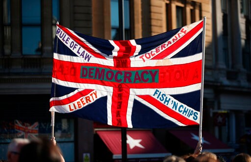 Brexit Minister Urges UK Conservatives to Unite behind May