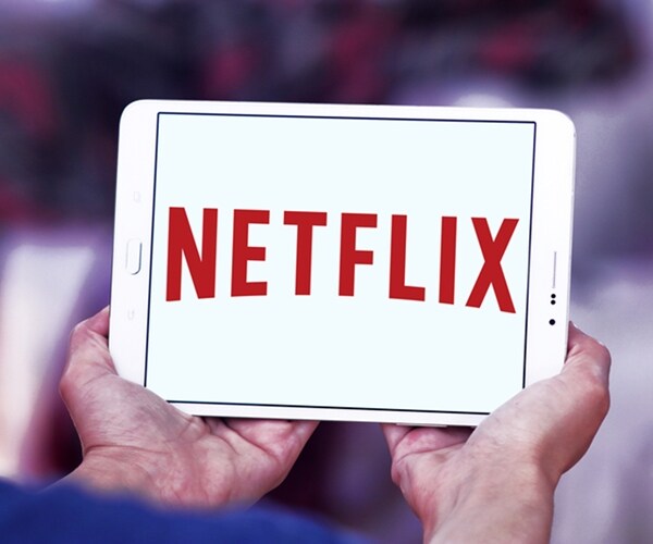 netflix logo corporate symbol on tablet screen