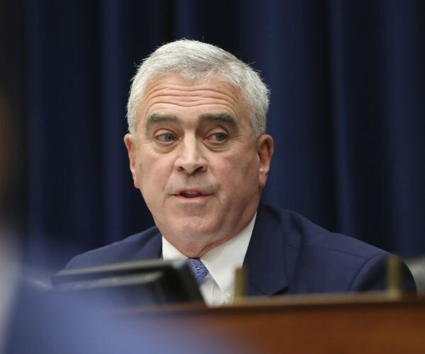 rep. brad wenstrup asking questions capitol hill in blue suit, white dress shirt and blue tie