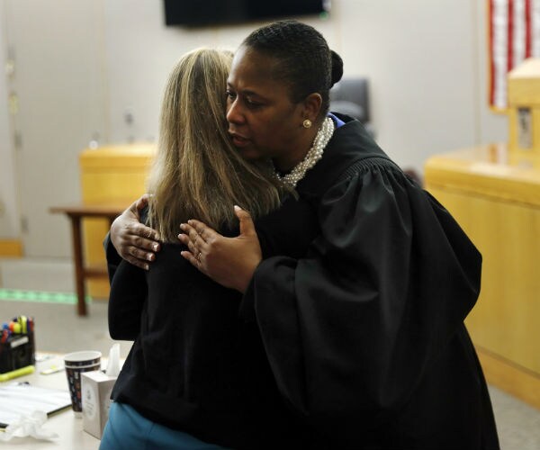 Judge Says She Couldn't Refuse Convicted Ex-Cop a Hug
