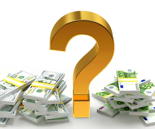 gold question mark amid stacks of cash