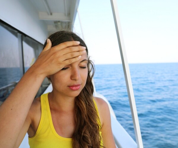 woman seasick on boat