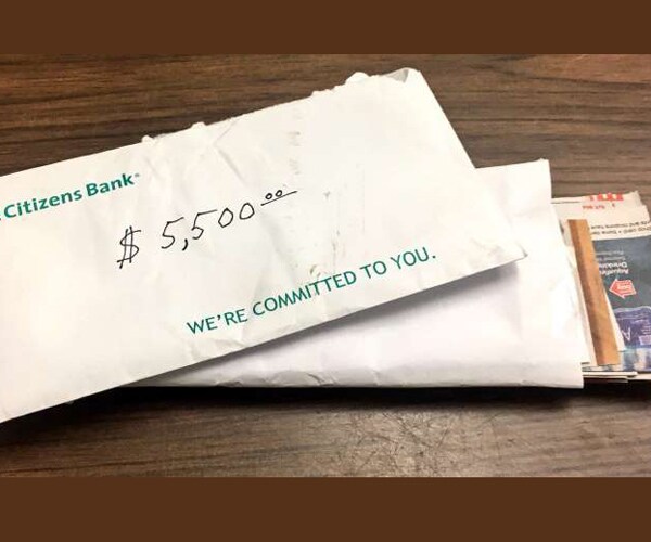 Woman Brings Bank Envelope to Police Without Opening It