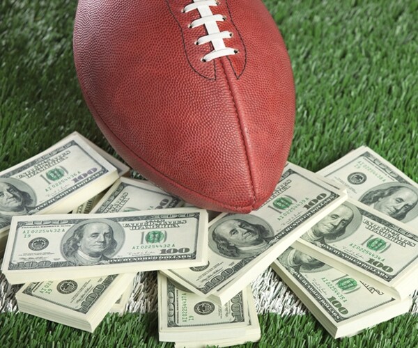 Colleges Weigh Scrapping Football Season in Threat to a Cash Cow