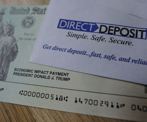 a deposit slip and sample stimulus check are shown 