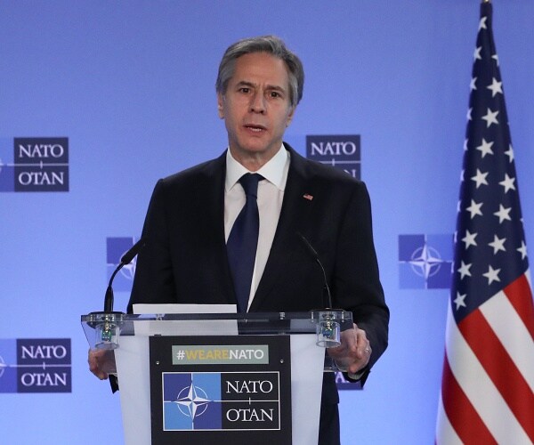 antony blinken speaks from podium