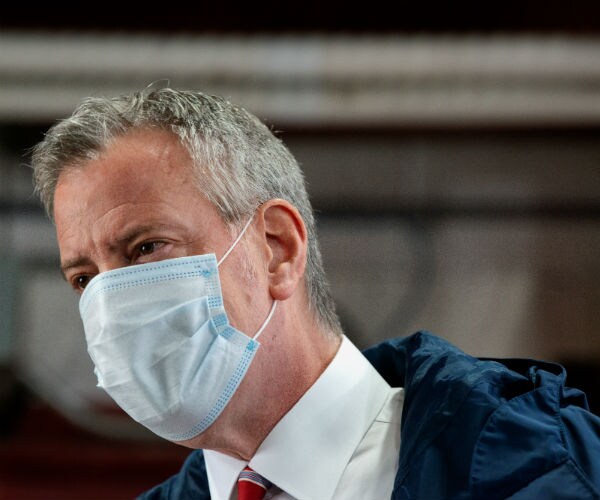 a masked bill de blasio is shown