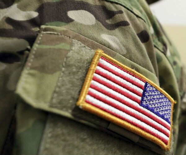 a military uniform is shown with the us flag on the right arm