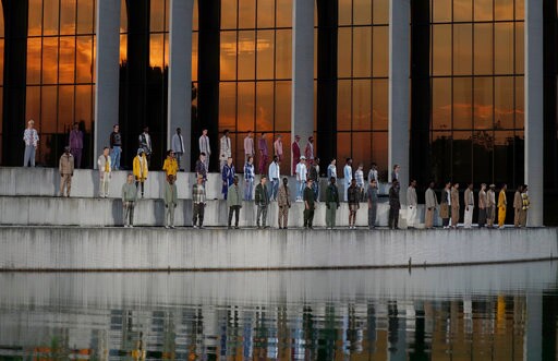 Zegna Couture Opens Milan Fashion Week against Arched Facade