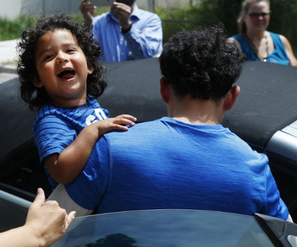 Reunited Immigrant Children Scooped Up Into Parents' Arms