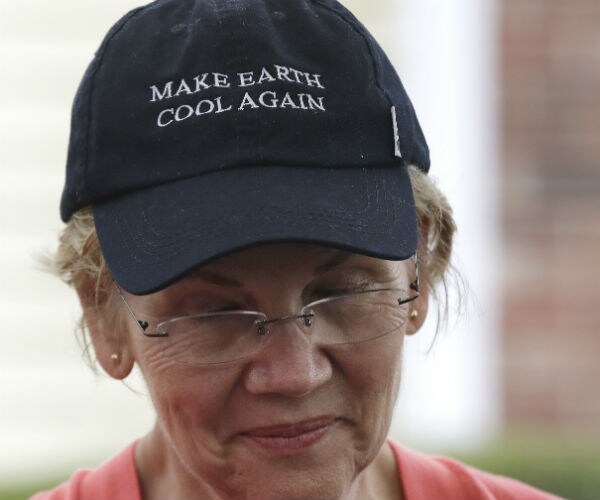 elizabeth warren is shown wearing a make america cool again hat
