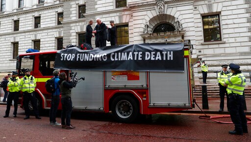 Climate Activists Spray Fake Blood on UK Government Building