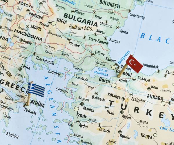 a map of greece and turkey with their flags inserted