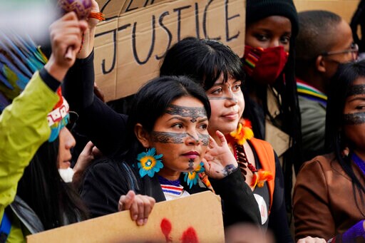 Clean up Your Mess, Youth Tell Climate Talks inside and out