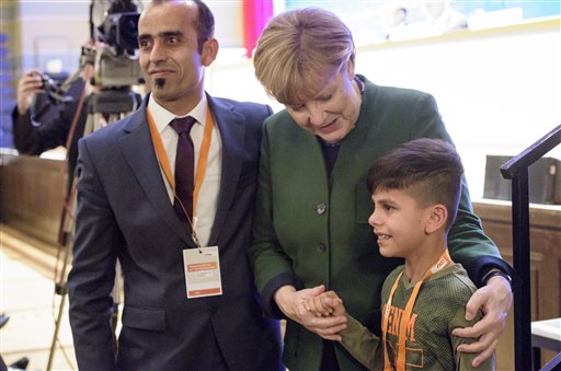 Germany's Merkel Thanked by Afghan Boy at Party Meeting