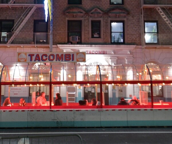 customers eating at outdoor part of restaurant