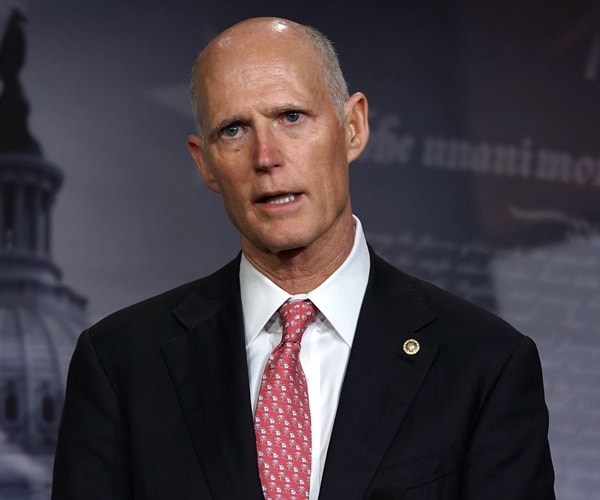 rick scott speaks during a new confernce