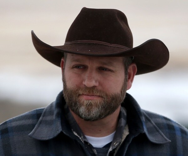 bundy in a plaid flannel shirt and brown cowboy hat