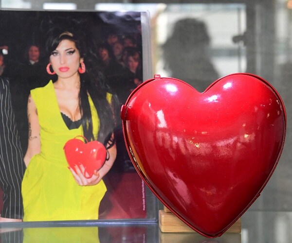 red leather heart shaped purse on display 