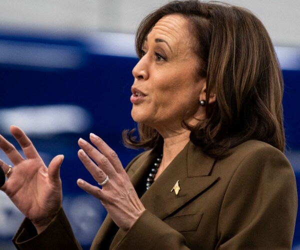 Kamala Harris gestures while speaking