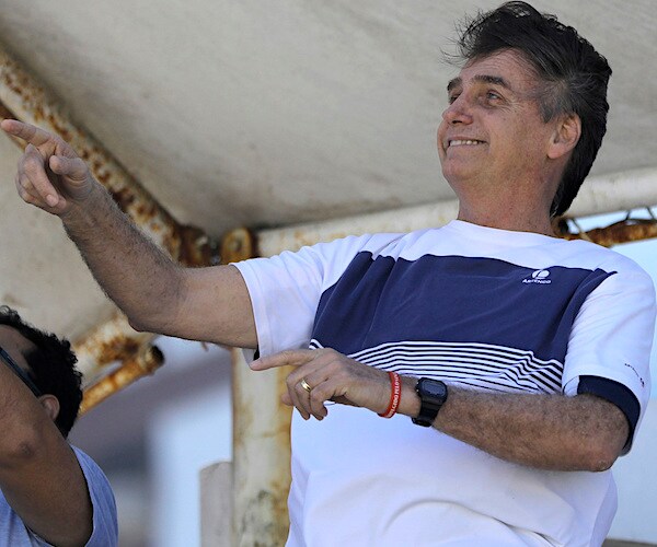 brazilian president jair bolsonaro gestures while in street clothes