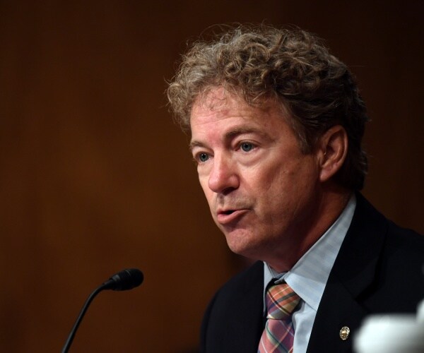rand paul in a suit and colorful plaid patterned tie