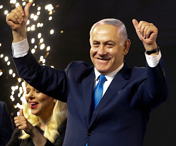 Israeli Prime Minister Benjamin Netanyahu exults in happiness after an election victory