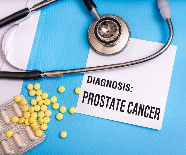 'Diagnosis: Prostate Cancer' and some pills and stethoscope