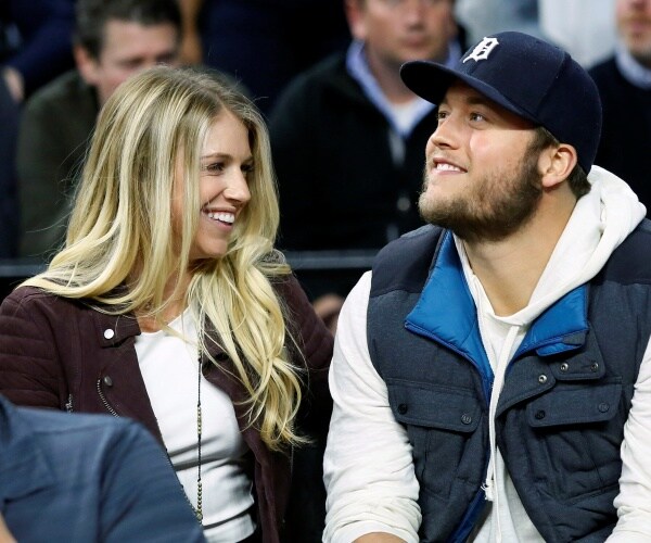kelly stafford in a white top and brown jacket with matthew in a gray blue and white jacket