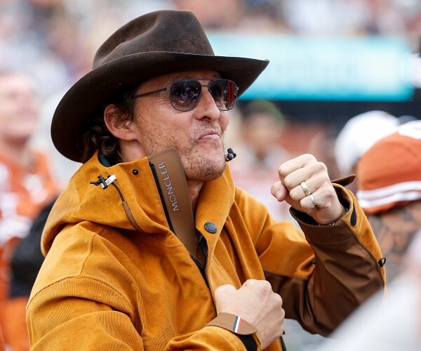 matthew mcconaughey stands on sideline