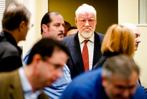 The Latest: 3 Cases Decided before war Crimes Hearing Halt