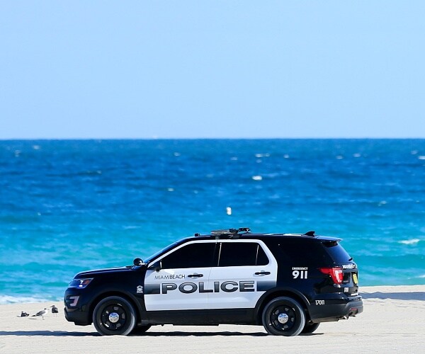police suv sits on beach