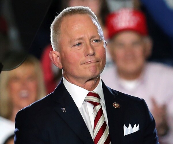 jeff van drew stands onstage