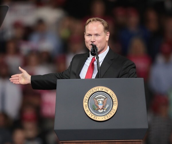 steve watkins introduces donald trump during a rally while running for the house