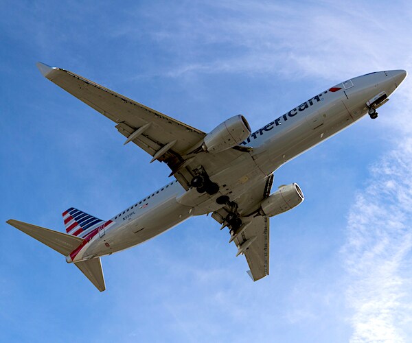 an american airlines jet in the air