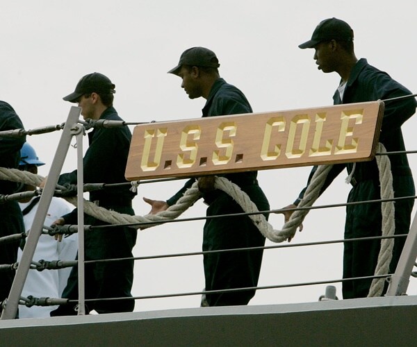 sailors on the u.s.s. cole prepare to leave port