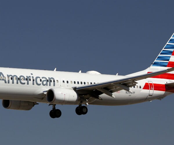 an american airlines airplane is shown getting ready to land